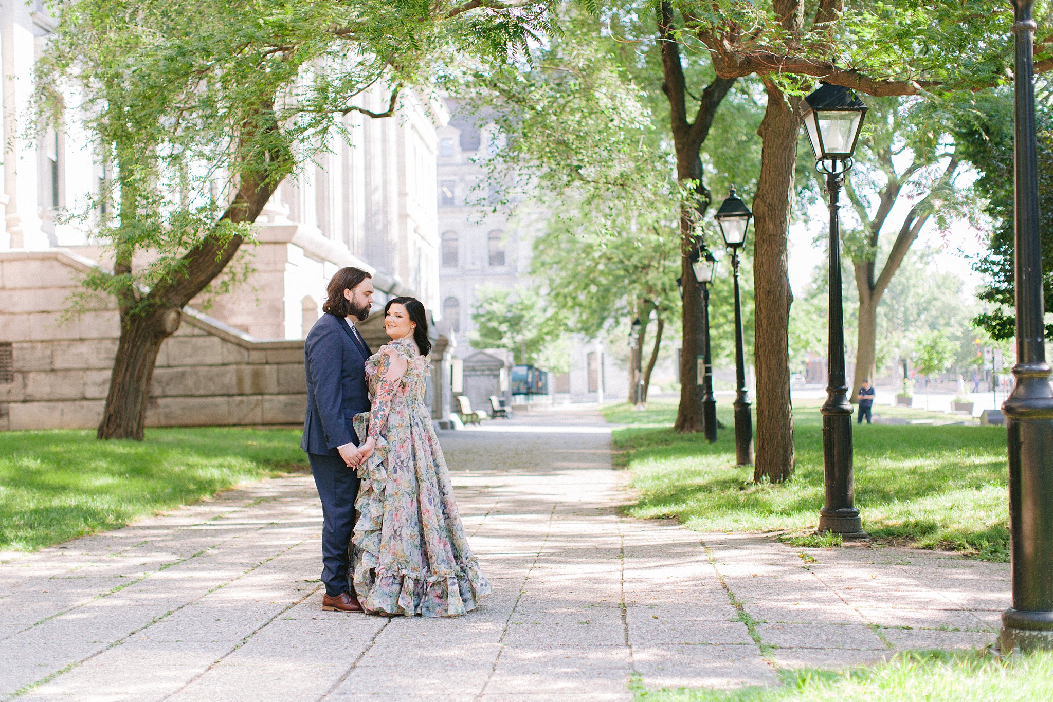 Newlyweds kissing in a lush Montreal garden