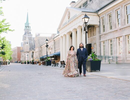 Couple walking down cobbled streets in Montreal