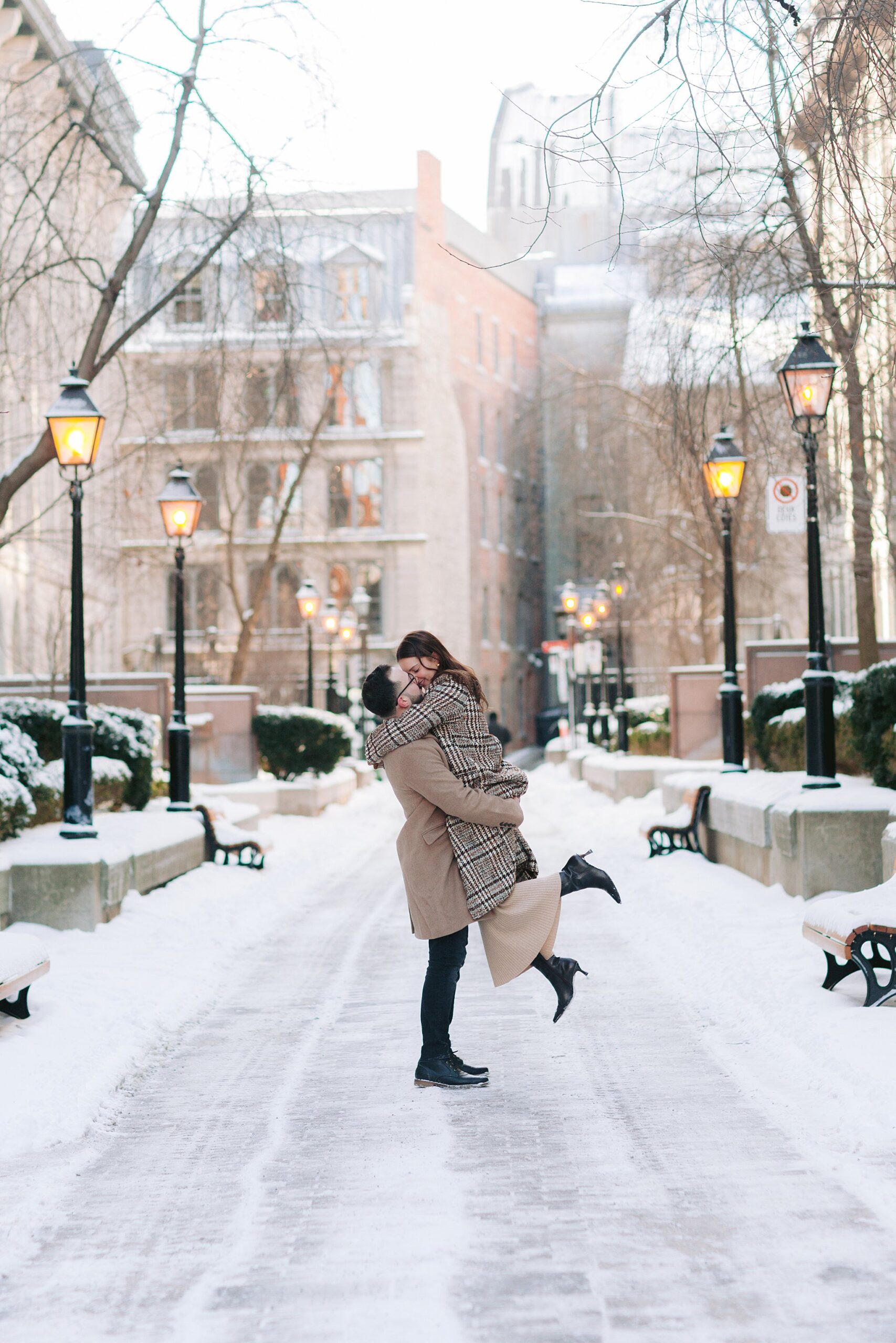 Playful and intimate couple’s photography session in snowy Montreal.