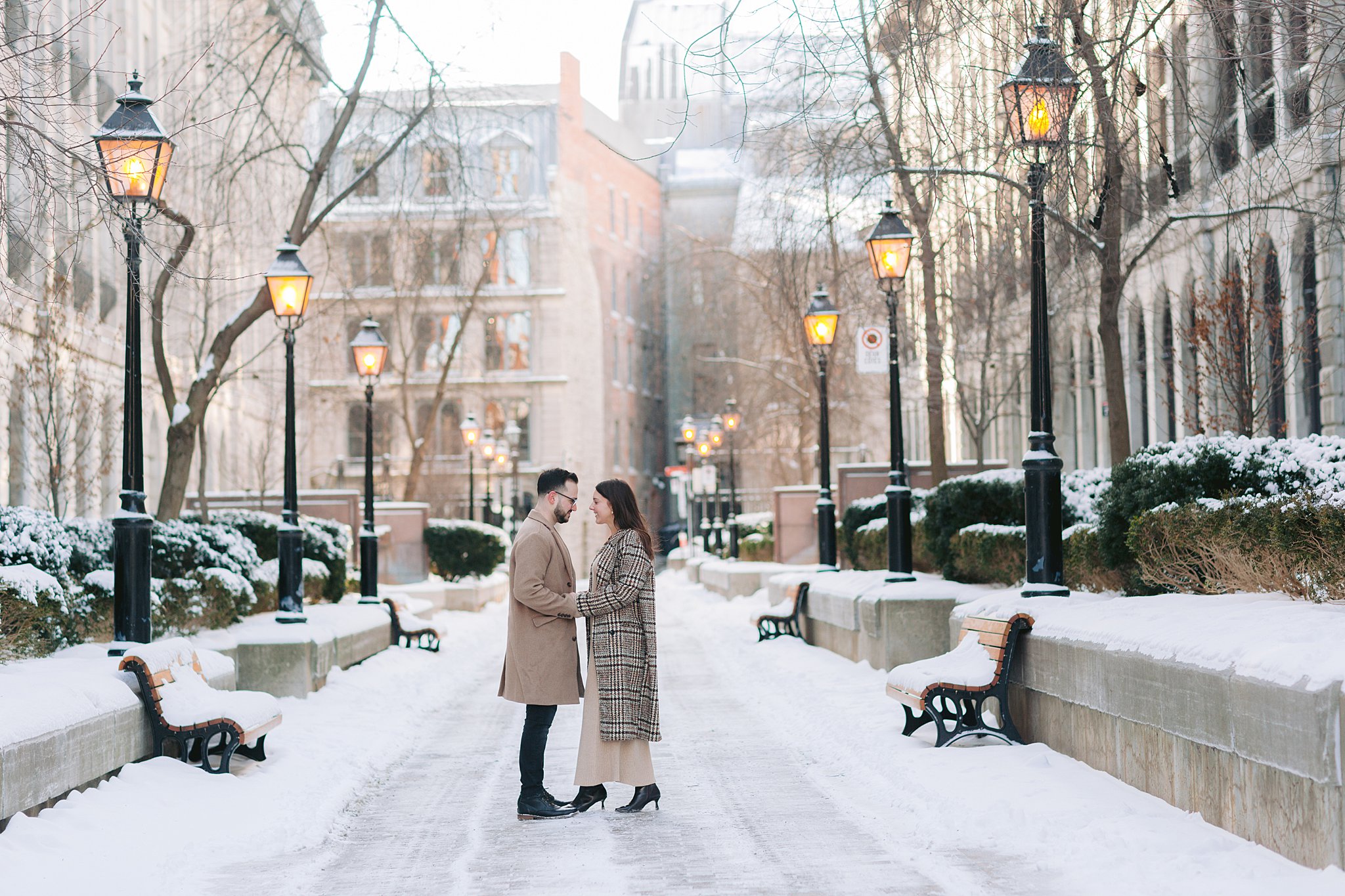 Snowfall adds magic to this Old Port engagement session in Quebec.