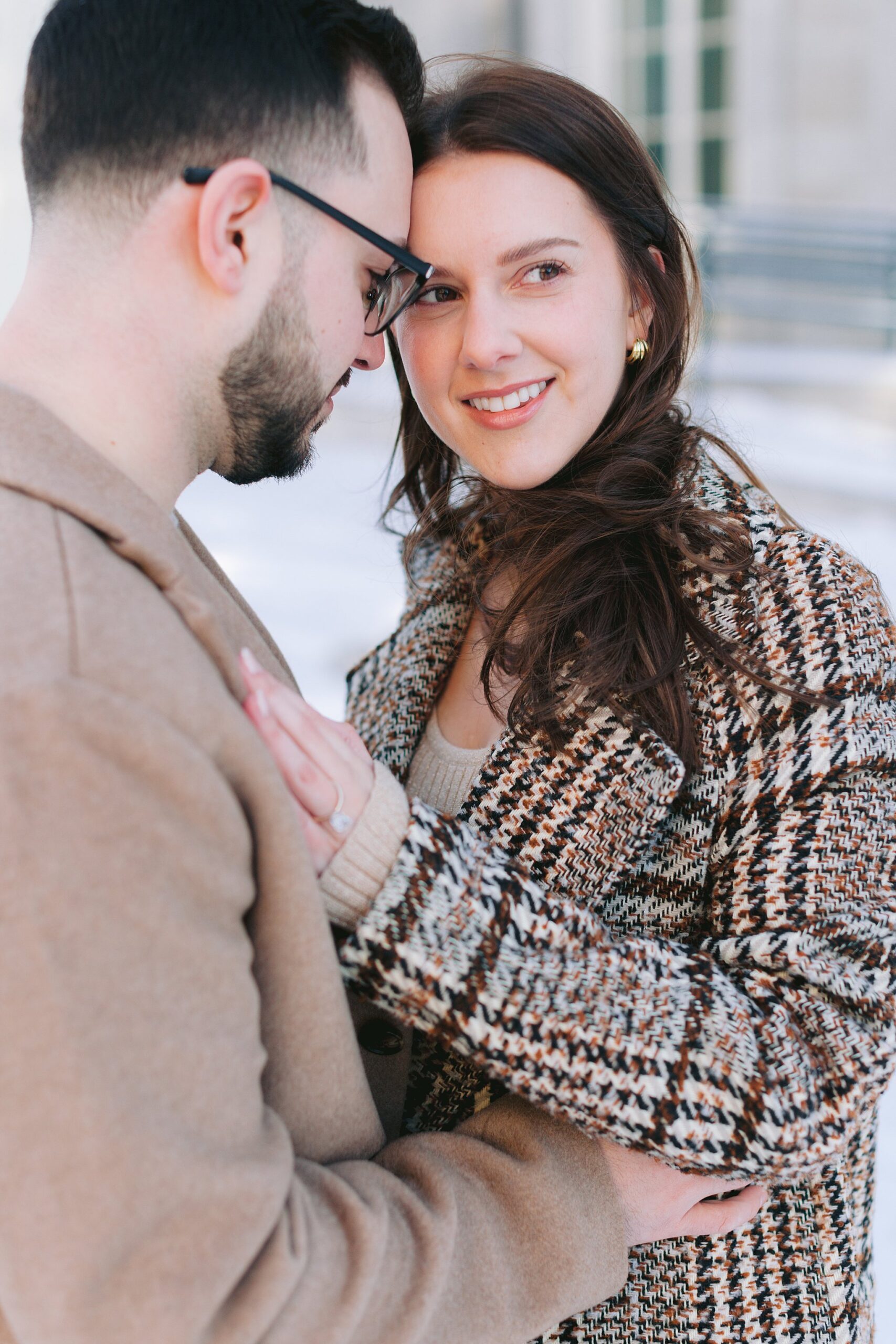 Couple’s snowy proposal session in Montreal’s historic Old Port, Quebec.